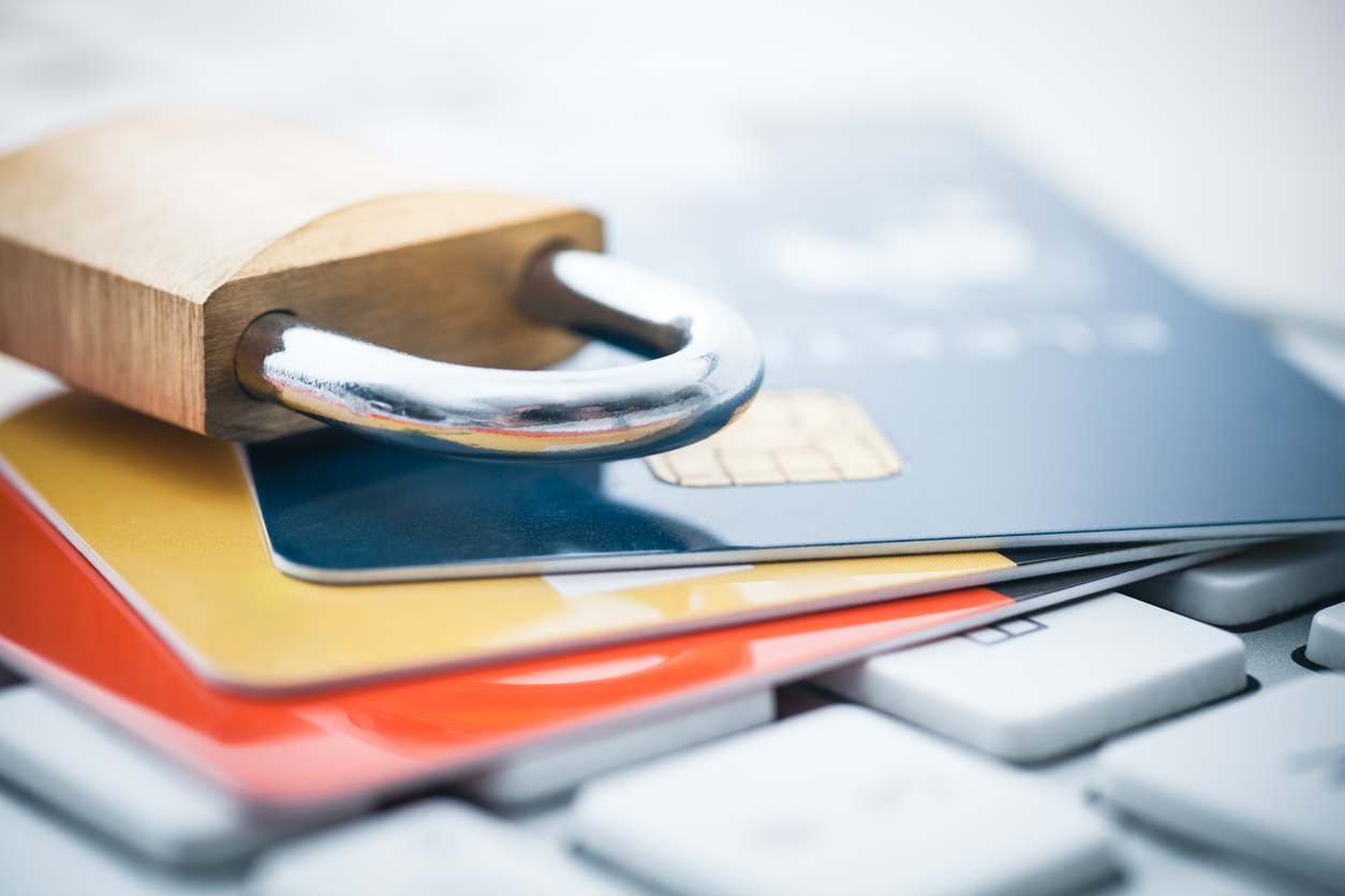 lock on top of a stack on credit cards on top of a keyboard